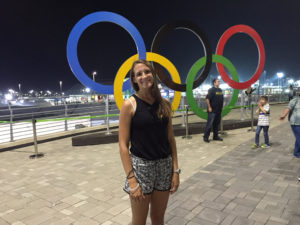 Angie Miller in front of the Olympic Rings